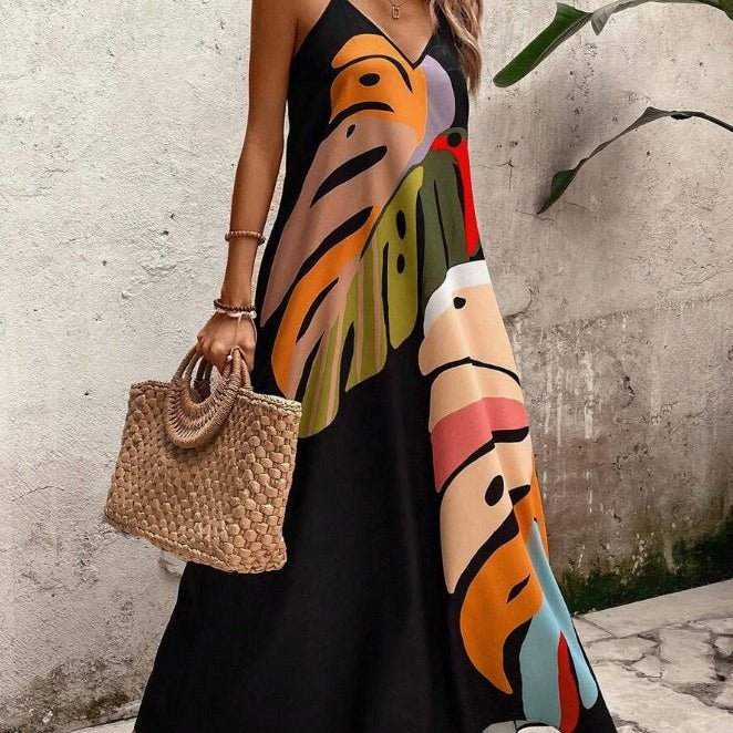 Women's abstract tropical print maxi sundress with V-neck & spaghetti straps for beach vacation.