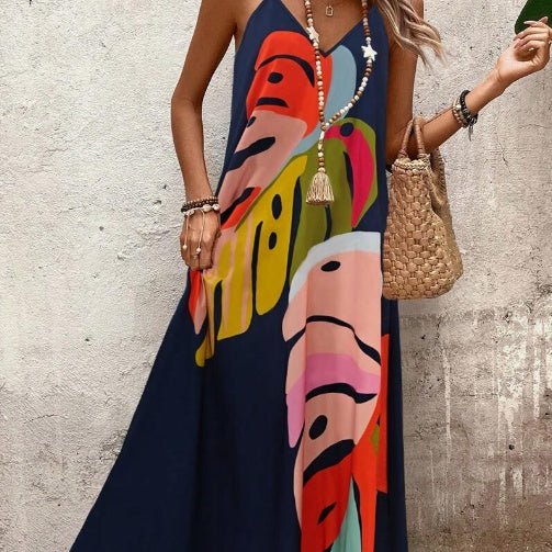 Elegant women's flowing maxi sundress, abstract tropical print, V-neck, spaghetti straps, resort wear.
