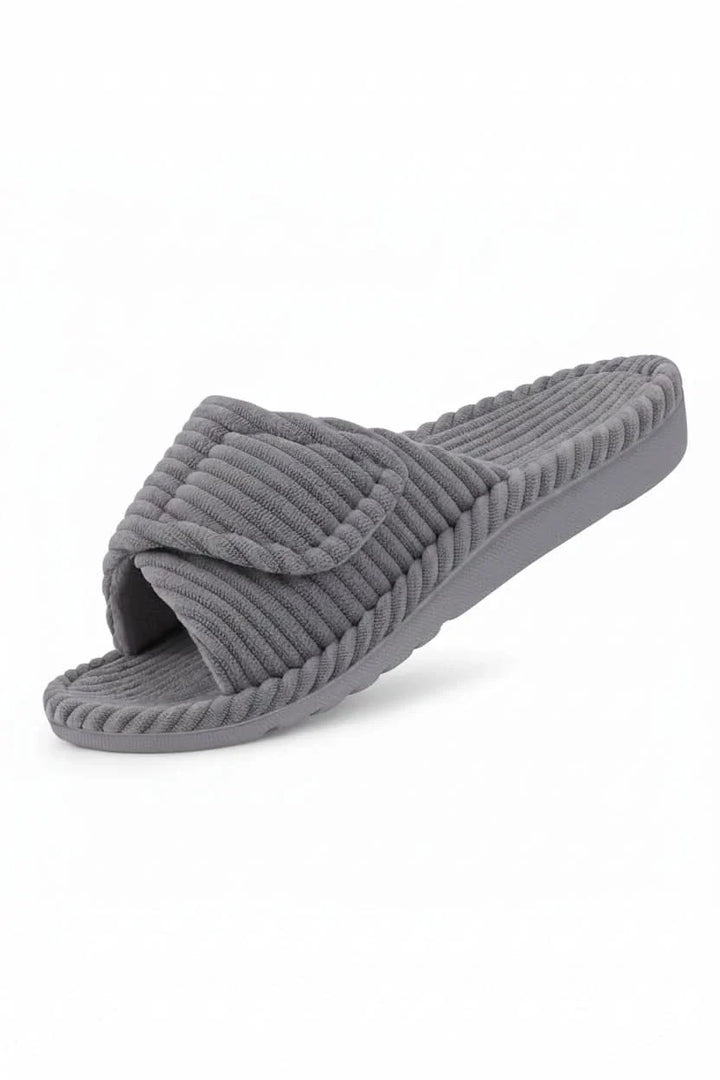 Side profile of women's adjustable comfort slippers, showing sole and strap.