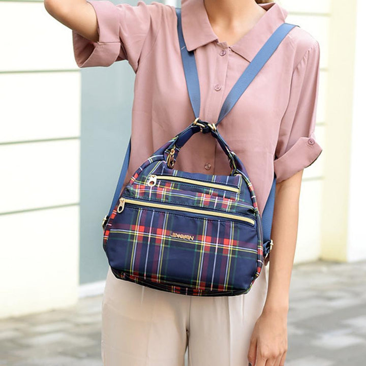 Close-up of waterproof nylon material on women's anti-theft bag.