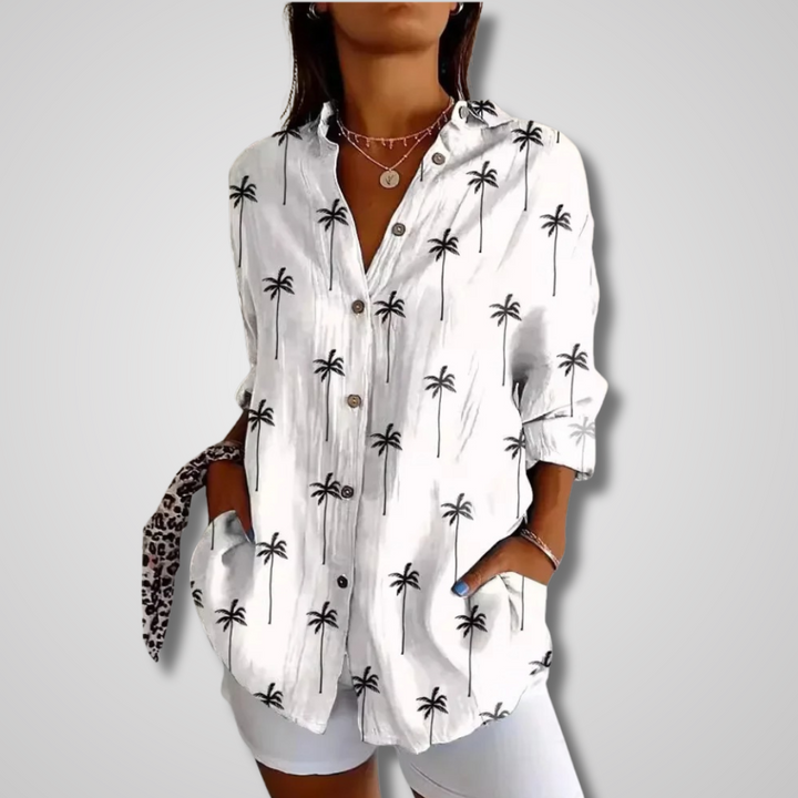 Bohemian style women's blouse with a unique artistic print, button-up front, and long sleeves for a relaxed, chic look.