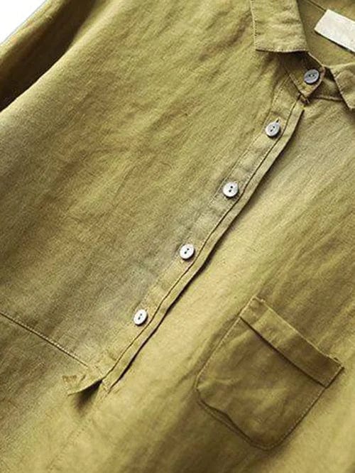 Stylish women's asymmetrical button-up blouse. Long-sleeve, collared, relaxed fit. Perfect for everyday fashion.