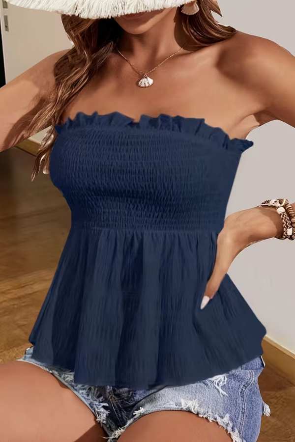Model wearing a women's flattering backless tube top in a vibrant color, perfect for sunny summer casual outfits.