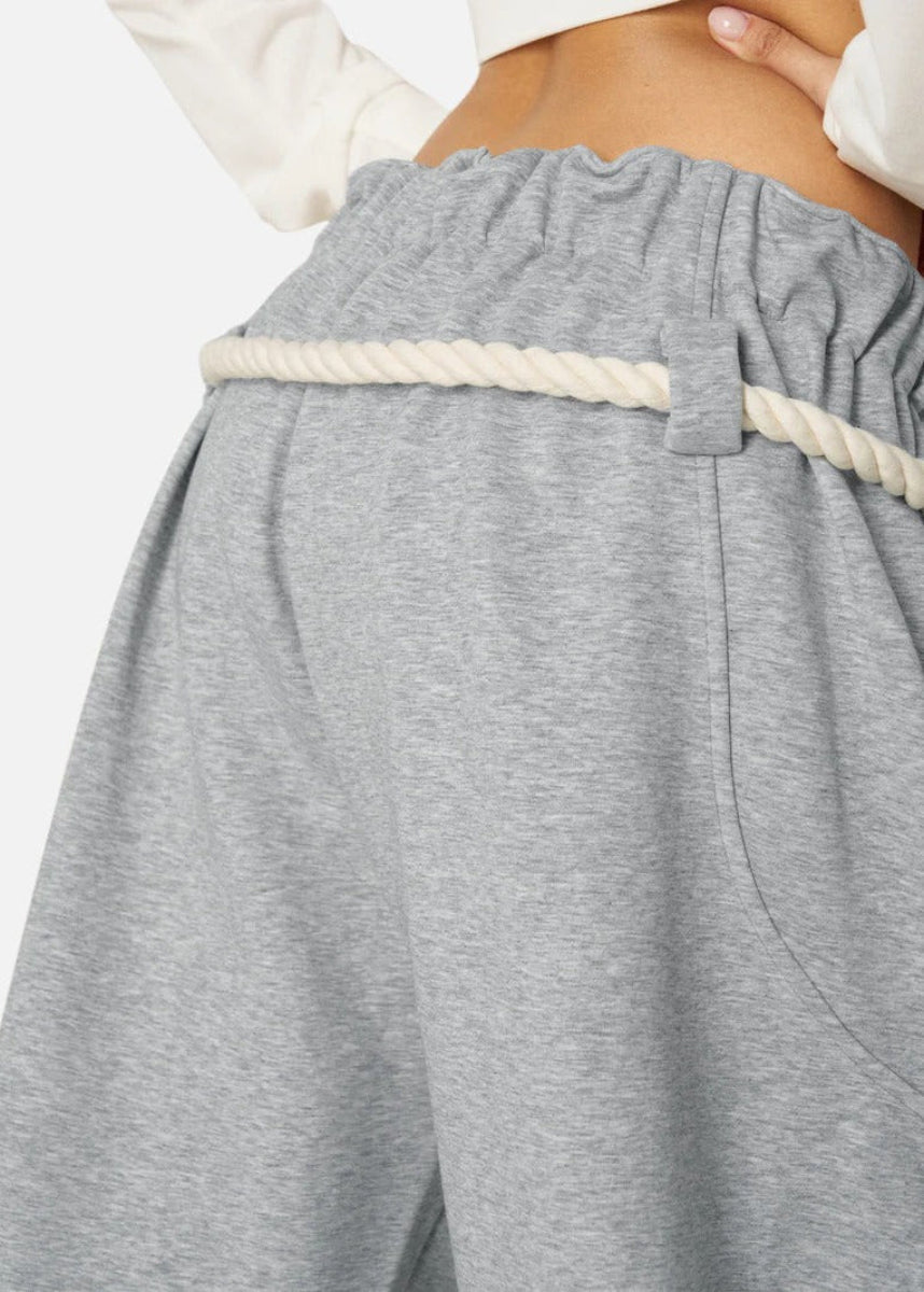 Chic women's baggy barrel leg sweatpants with elastic waist, offering a relaxed wide-leg silhouette.