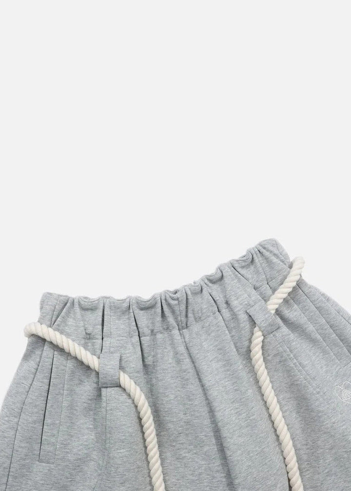 Distinctive barrel leg women's sweatpants, offering a trendy baggy fit and comfortable elastic waist.