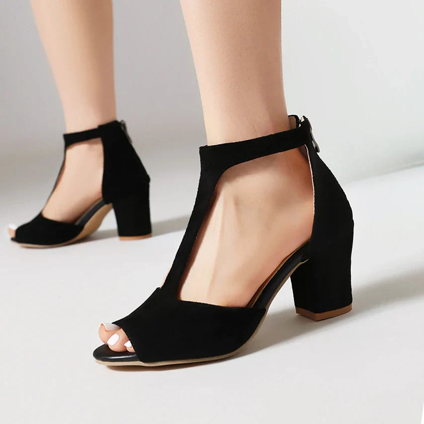 Women's beige block heel sandals showcasing a comfortable orthopedic footbed and t-strap