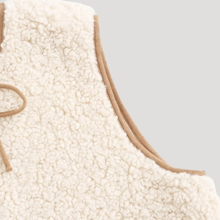 Casual women's tie-front vest in a lightweight, cozy beige fabric, front view.