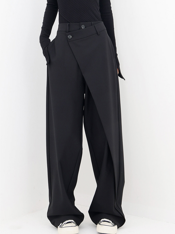 Women's black asymmetric baggy trousers, relaxed fit for casual chic style.