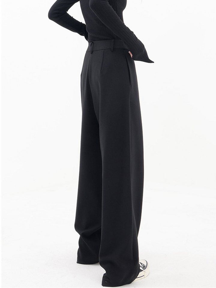 Women's black asymmetric baggy trousers, a relaxed fit pant for modern, casual wear.