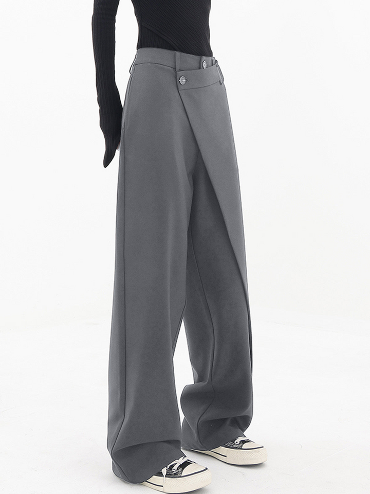 Grey asymmetric baggy trousers for women, ideal for a relaxed fit and all-day comfort.