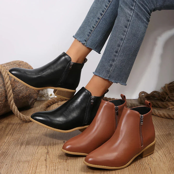Comfortable black women's ankle boots with side zip, essential casual footwear for daily wear