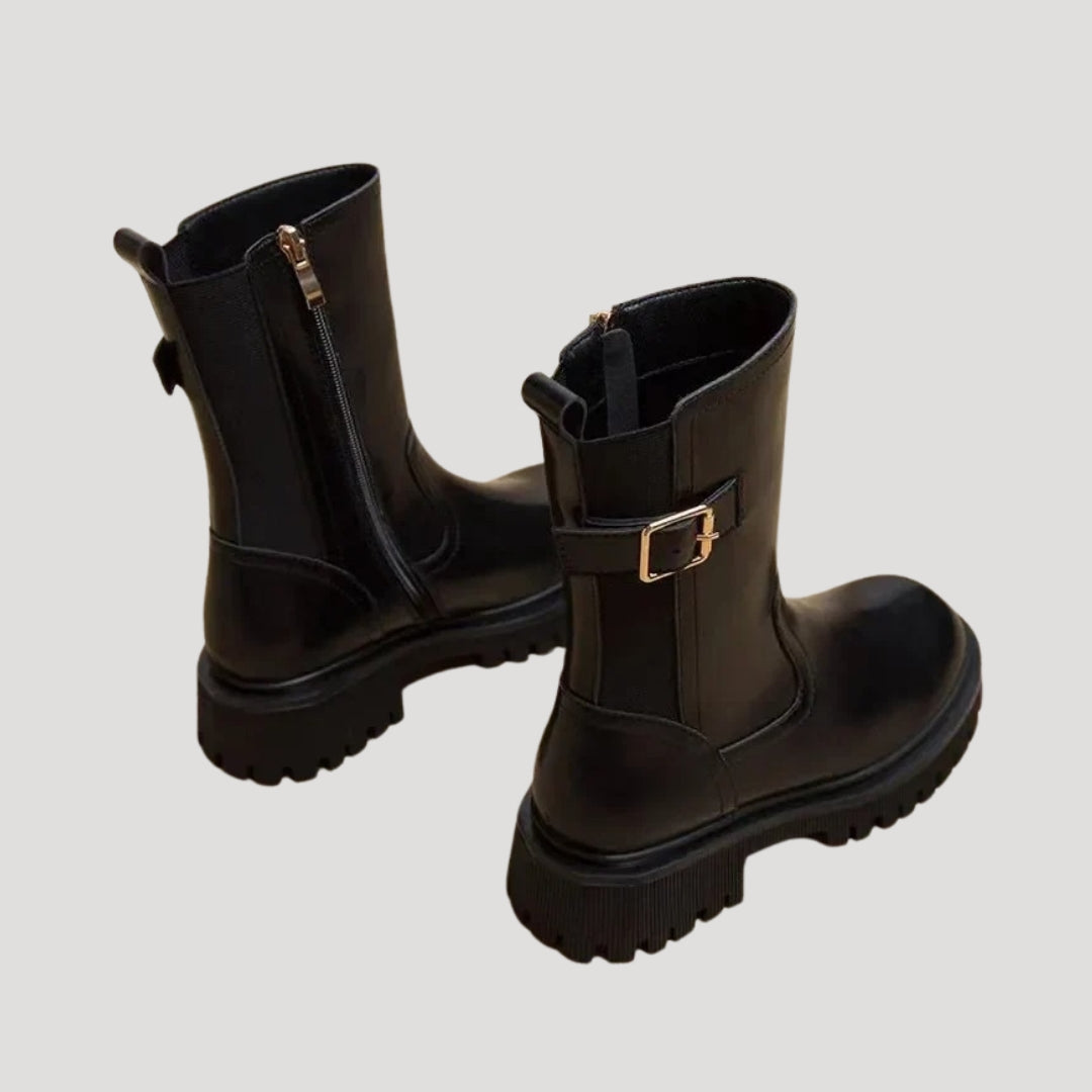 Black women's mid-calf boots with a chunky design, versatile for spring fashion.