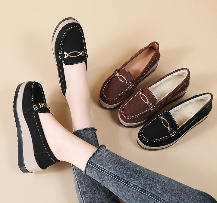Collection of women's platform loafers in black and brown, emphasizing comfort and style