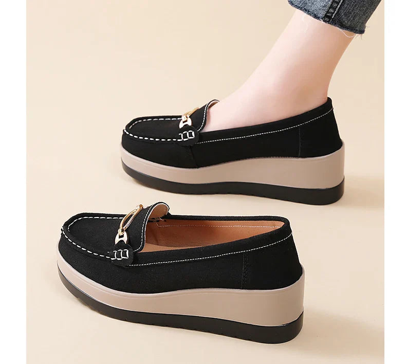 Orthopedic black platform loafers for women, providing arch support and all-day comfort