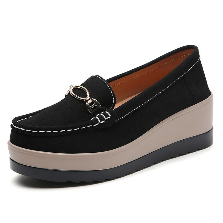 Texture close-up of a women's platform loafer, highlighting the quality material and finish