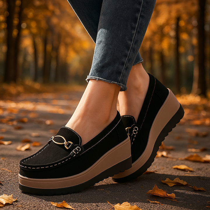 Pair of women's black platform loafers, designed for orthopedic comfort and long wear
