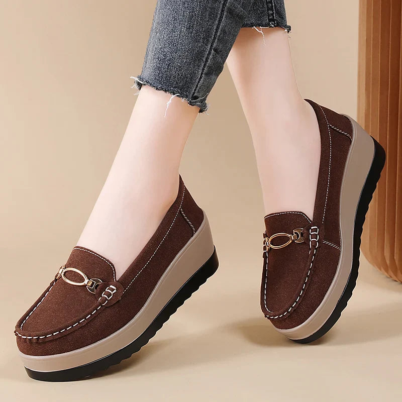 Women's black platform loafers with a sleek design, ideal for both work and casual outings