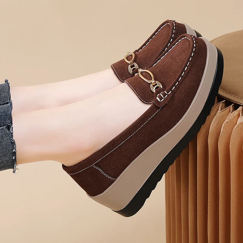 Side profile of a brown women's platform loafer, showcasing the comfortable footbed