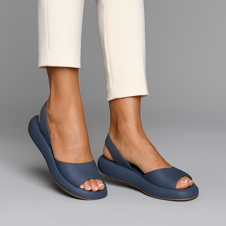 Close-up of women's comfort wedge slides, black with ergonomic footbed, summer sandals