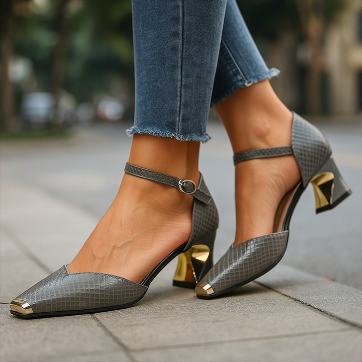 Chic women's croc-embossed block heel shoes featuring a stylish metal tip and secure ankle strap