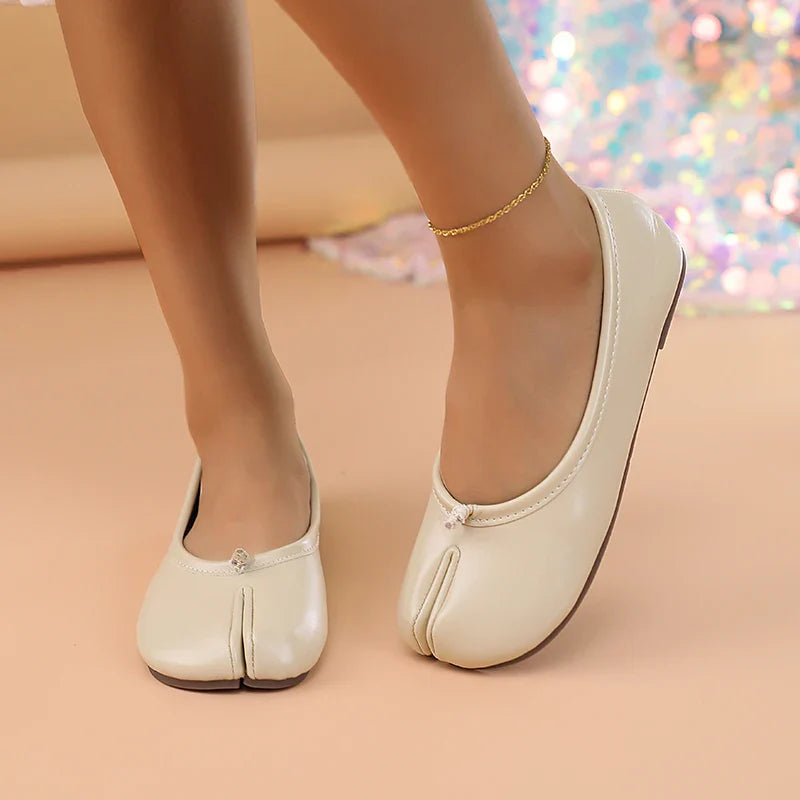 Stylish women's slip-on flats, featuring a trendy split toe and easy-to-wear design.