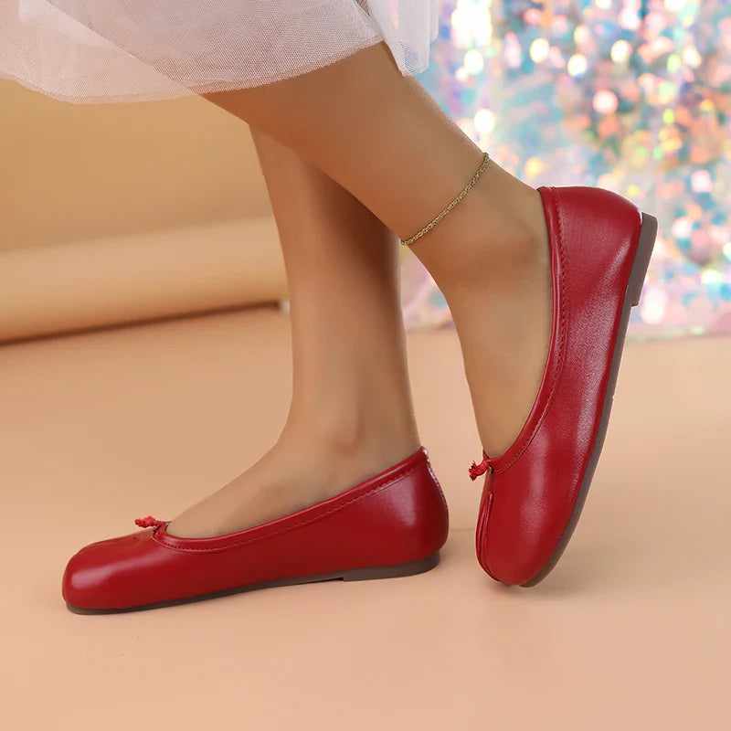 Sleek black women's tabi style flats, comfortable and easy to slip on.