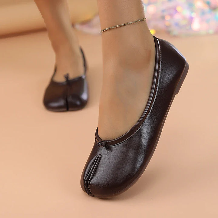 Women's casual slip-on split toe flats, designed for comfort and modern appeal.