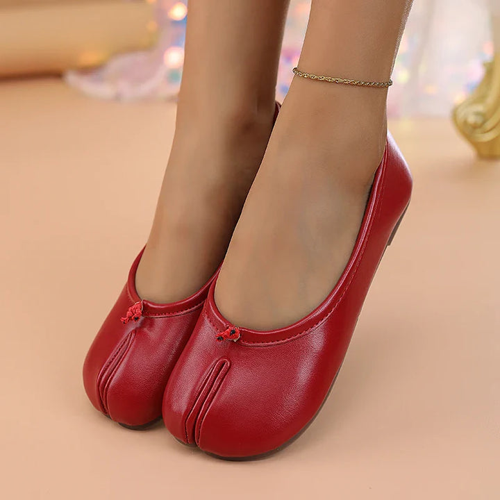 Women's faux leather tabi flats, a chic and comfortable addition to any outfit.