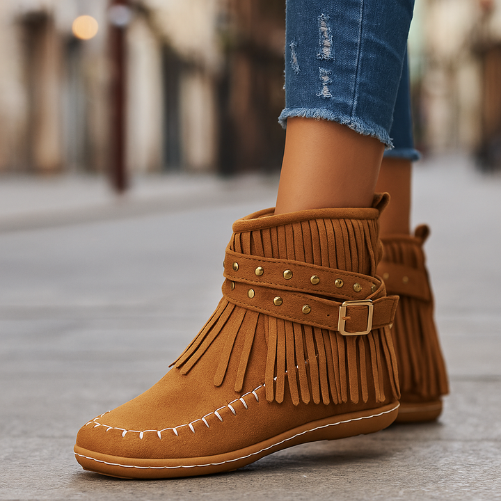 Women's black fringe ankle boots with studded buckle, boho chic style