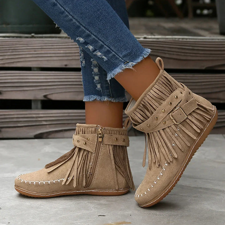 Full shot of women's black fringe ankle boots, ready to wear, casual and chic