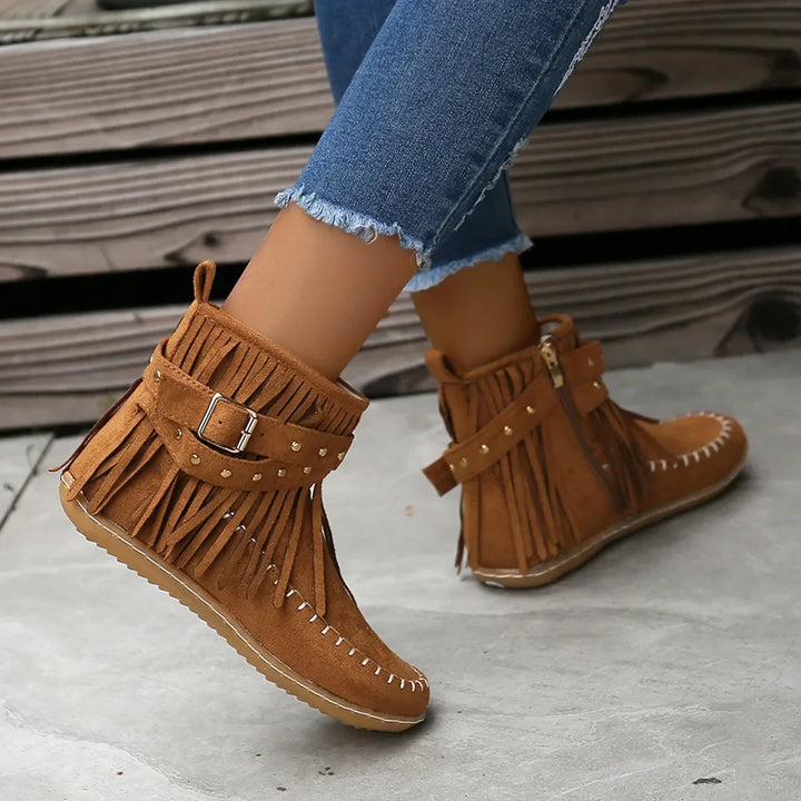 Comfortable women's black fringe ankle boots, designed with a trendy studded buckle