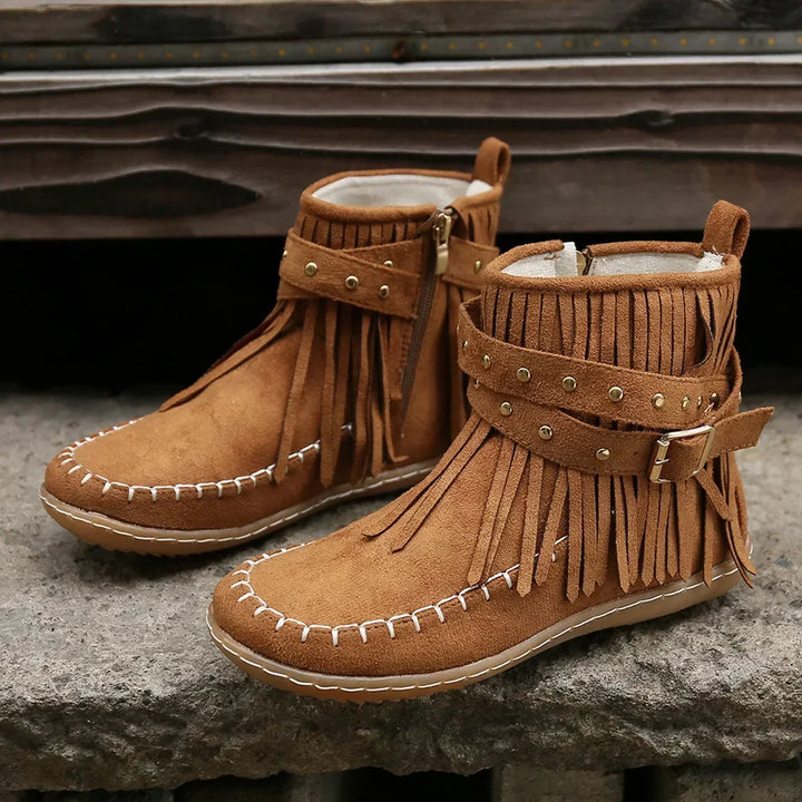 Back view of women's fringe ankle boots, highlighting warm-lined interior and comfort