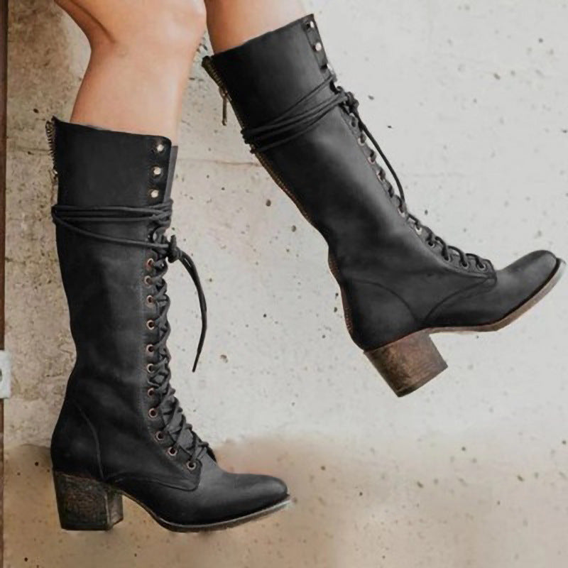 Women's black lace-up knee-high boots with sturdy block heel for winter style.