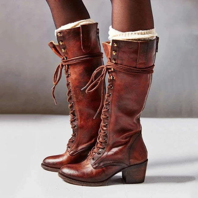 Elegant women's knee-high lace-up boots featuring a stable block heel, perfect for autumn.