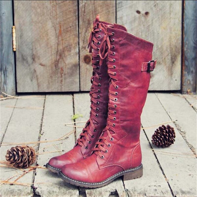 Stylish women's knee-high lace-up riding boots, designed for comfortable everyday wear and versatile fall outfits.