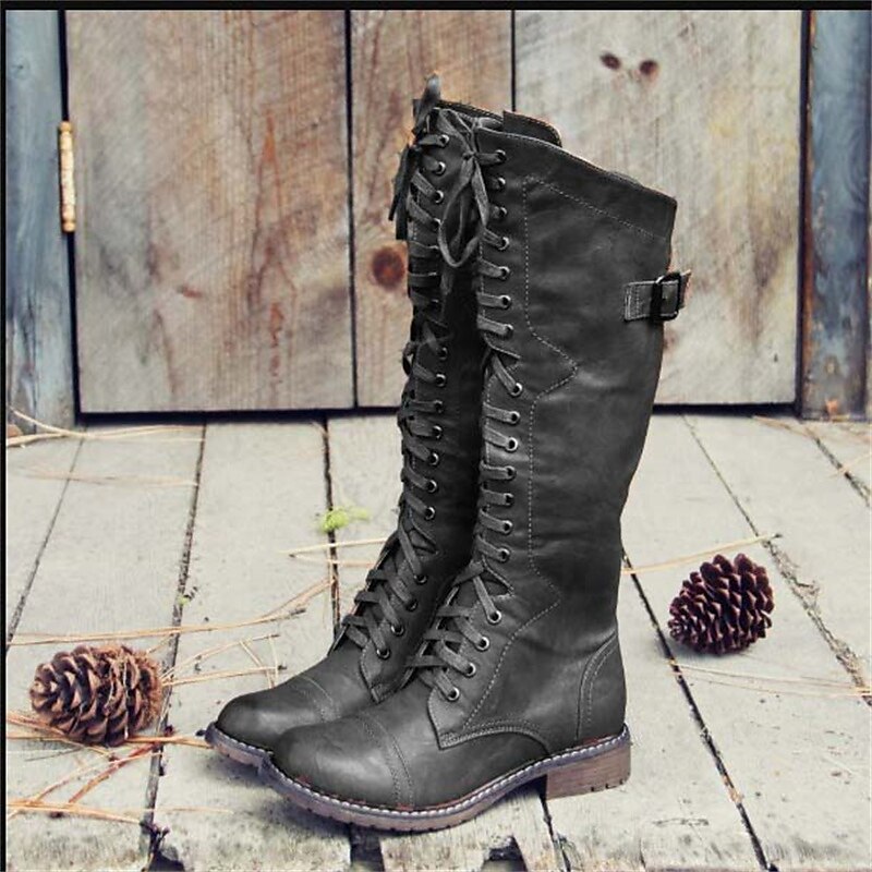 Classic women's knee-high lace-up riding boots for a chic everyday look. Ideal for cool weather style.