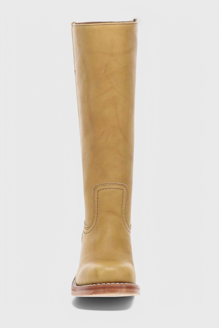 Women's leather knee-high boots displayed on a clean background, highlighting their elegance.