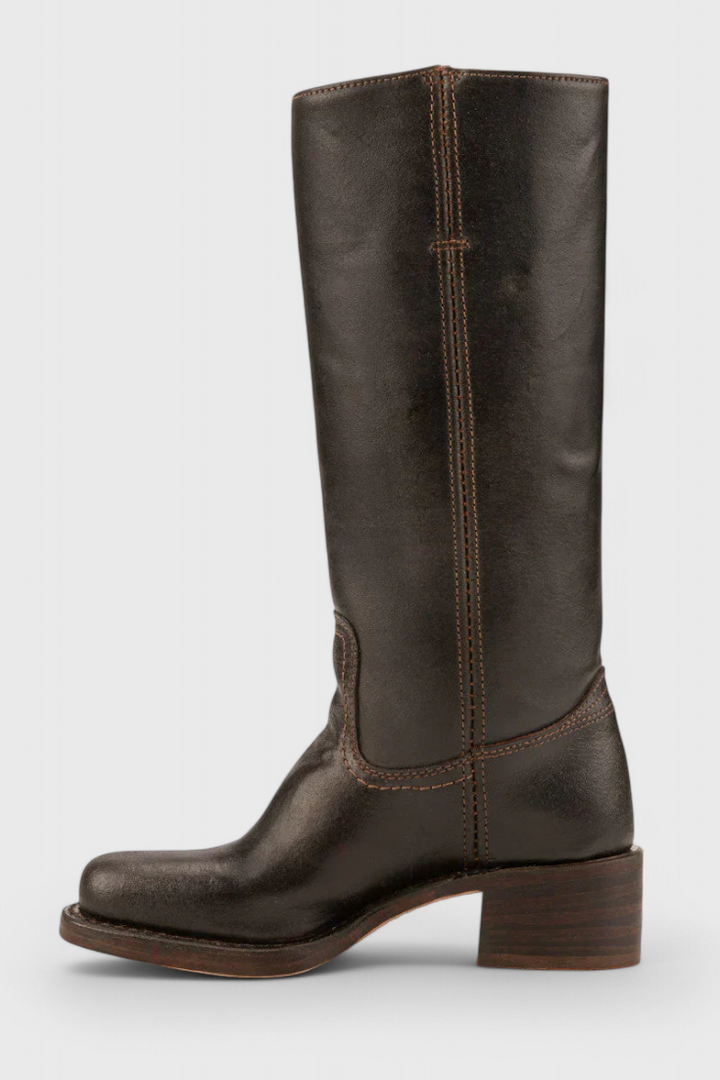Fashionable women's leather knee-high boots, heeled for an elevated and elegant silhouette.