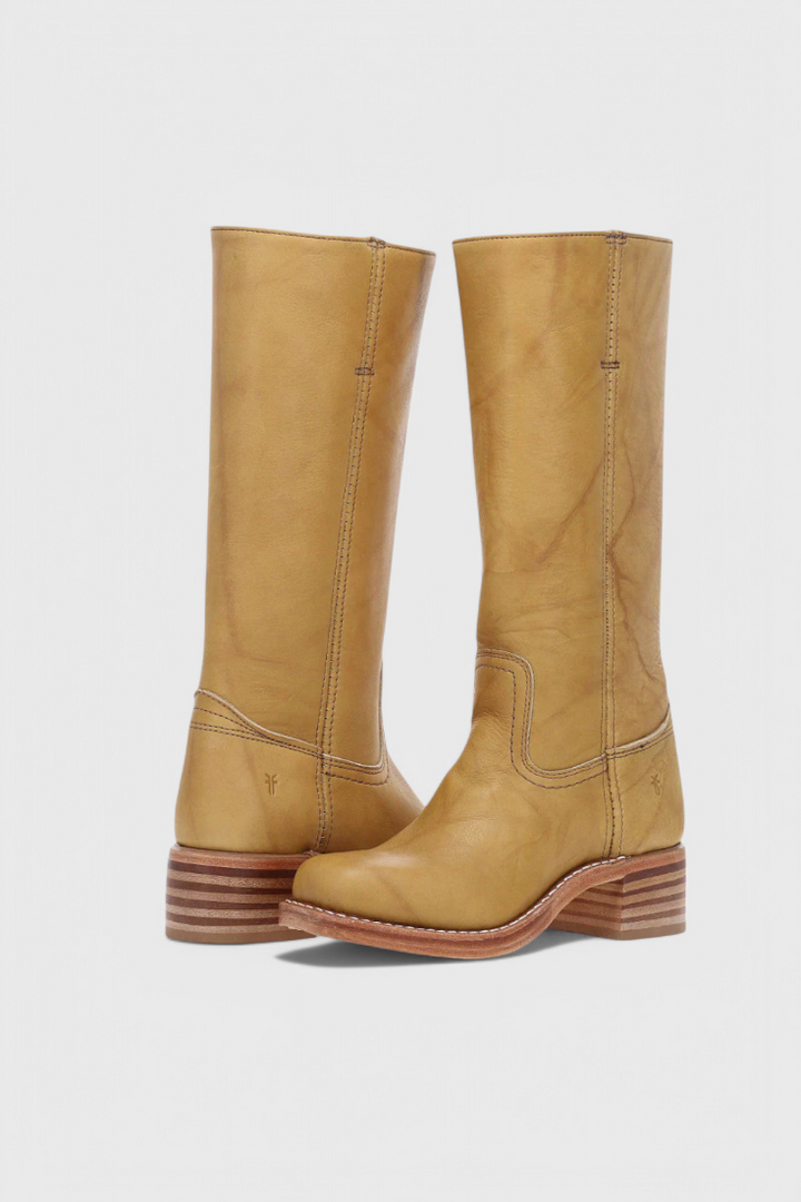 Pair of women's heeled knee-high leather boots, front view showcasing the sleek design.