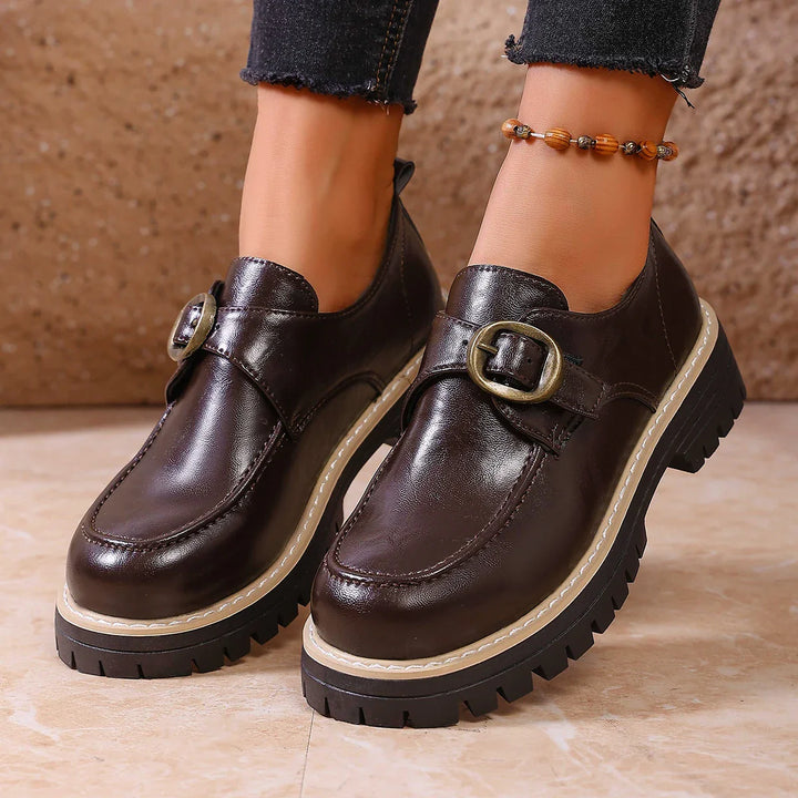 Brown leather buckle loafers for women, a timeless and comfortable footwear option.