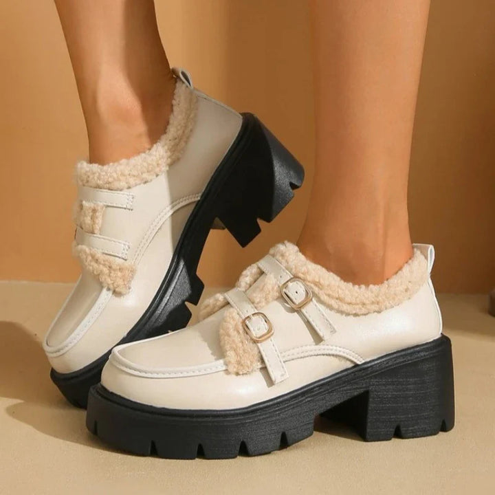 Angled shot of women's comfortable shearling-lined leather platform buckle shoes for casual outings