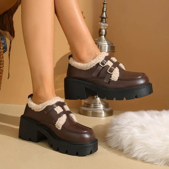 Top-down view of women's leather platform buckle shoes, showcasing the sleek design & comfort