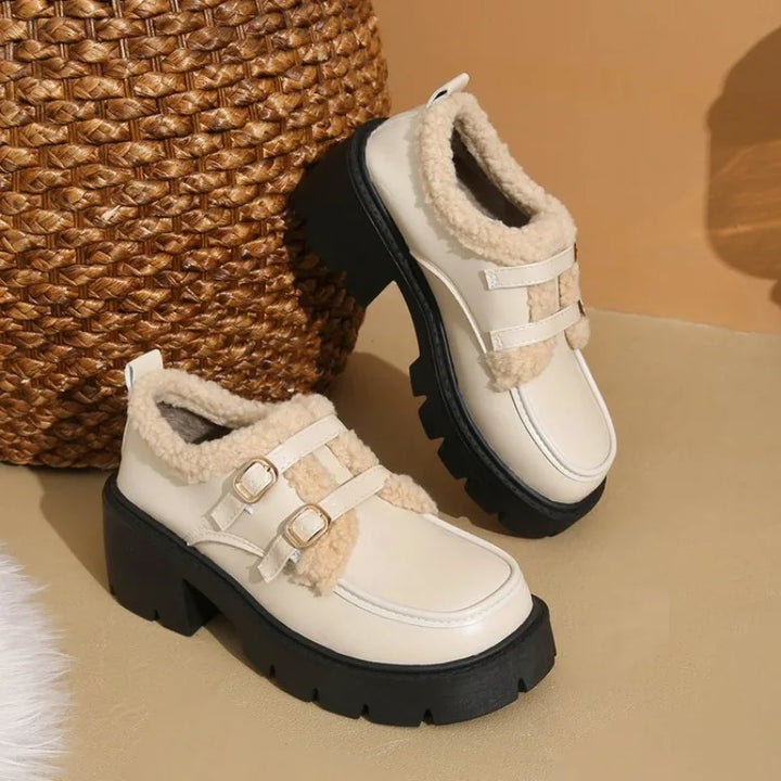 Detail of the shearling interior in women's leather platform shoes, emphasizing warmth & comfort