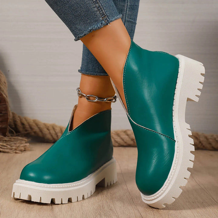Modern women's slip-on platforms made of soft leather, perfect for effortless style.