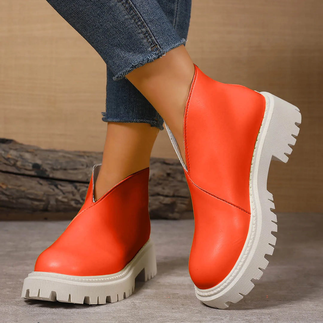 Durable women's platform slip-on shoes crafted from high-quality leather for lasting comfort.