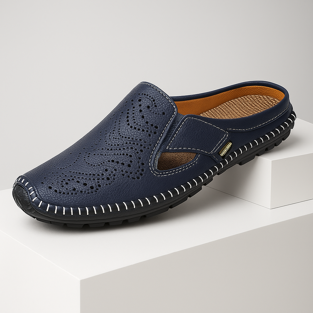 Women's black leather slip-on mules with perforated detail, perfect for casual summer wear.