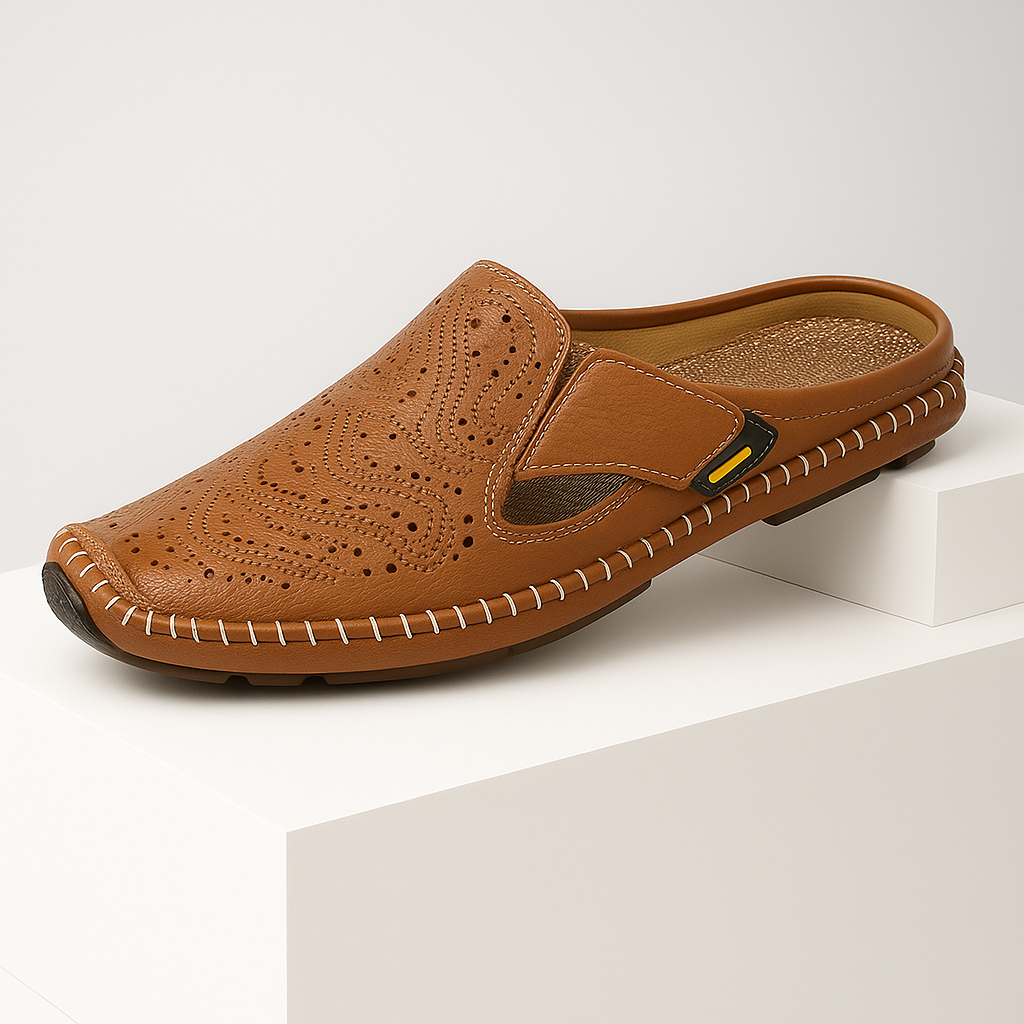 Stylish women's leather mules, slip-on design with intricate perforations for comfort and breathability.
