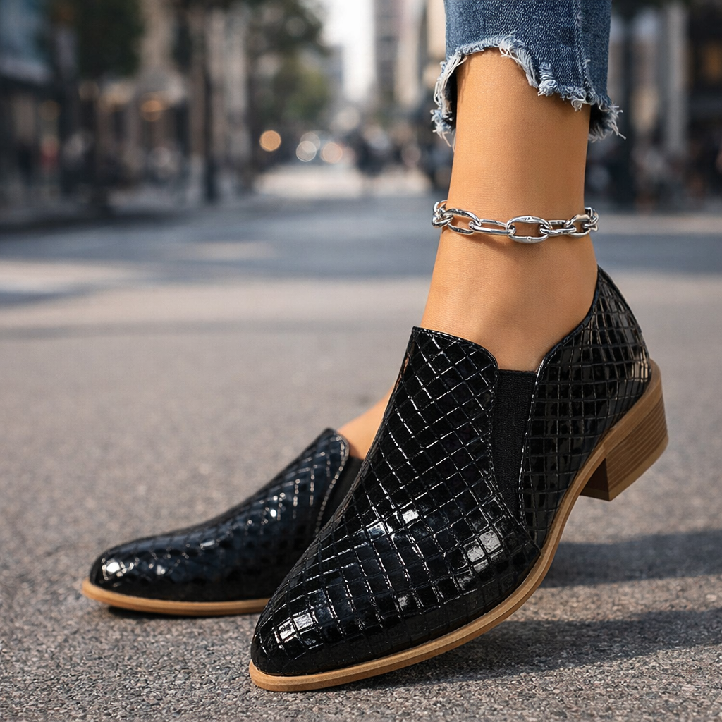Close-up of the intricate woven leather texture on a women's slip-on ankle boot in a neutral color.