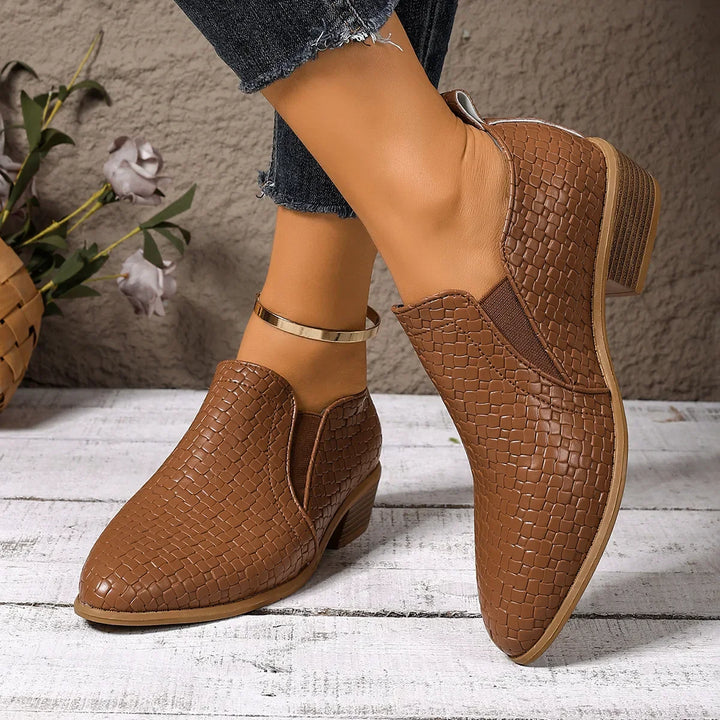 Comfortable women's slip-on ankle boots in genuine leather with an elegant woven pattern, versatile for any outfit.
