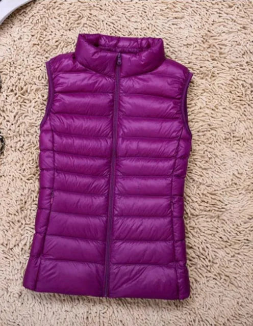 Side profile of a women's casual lightweight puffer vest with zip front, essential winter outerwear.